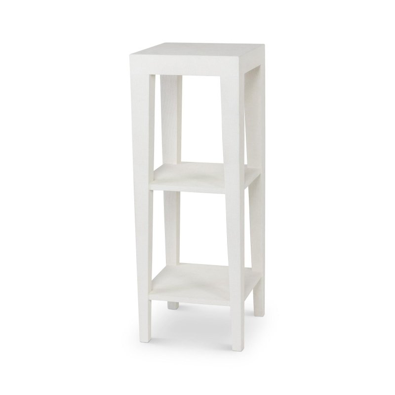 Three-quarter view of the Giraffe Leg soft Silk Linen white faux raffia pedestal with two open shelves and tapered legs
