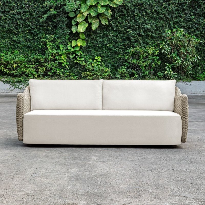 Sunset outdoor sofa styled in an outdoor lounge setting
