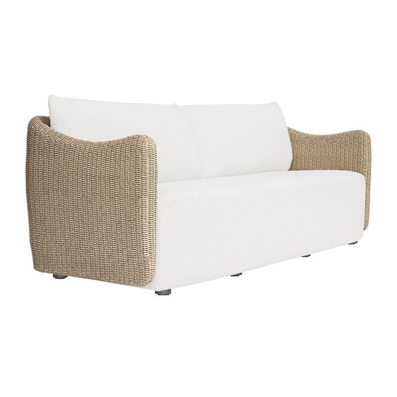 Angled view of the Sunset outdoor sofa with white cushions