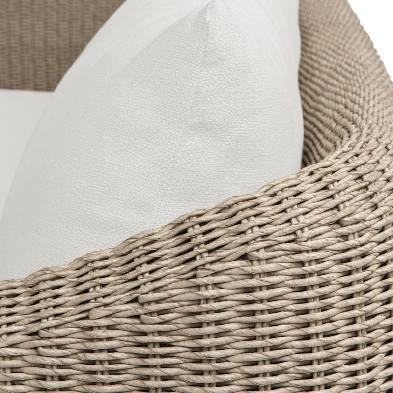 Close-up of the Sunset outdoor sofa woven frame and white cushion