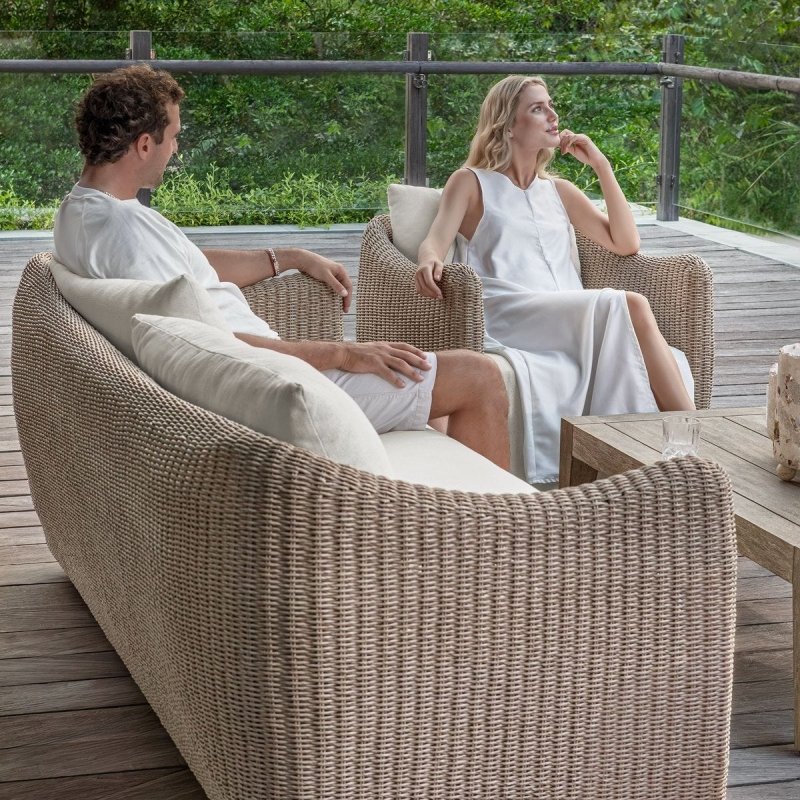 Sunset outdoor sofa styled in an outdoor conversation area