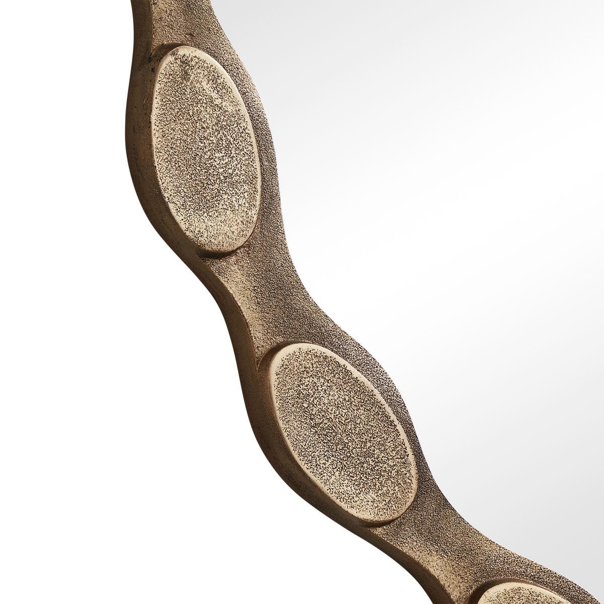 Side view of the Marietta Aged Brass Round Wall Mirror by Uttermost