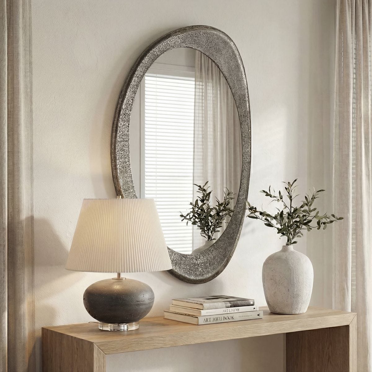 Schiller Antique Nickel Oval Wall Mirror styled in a room setting