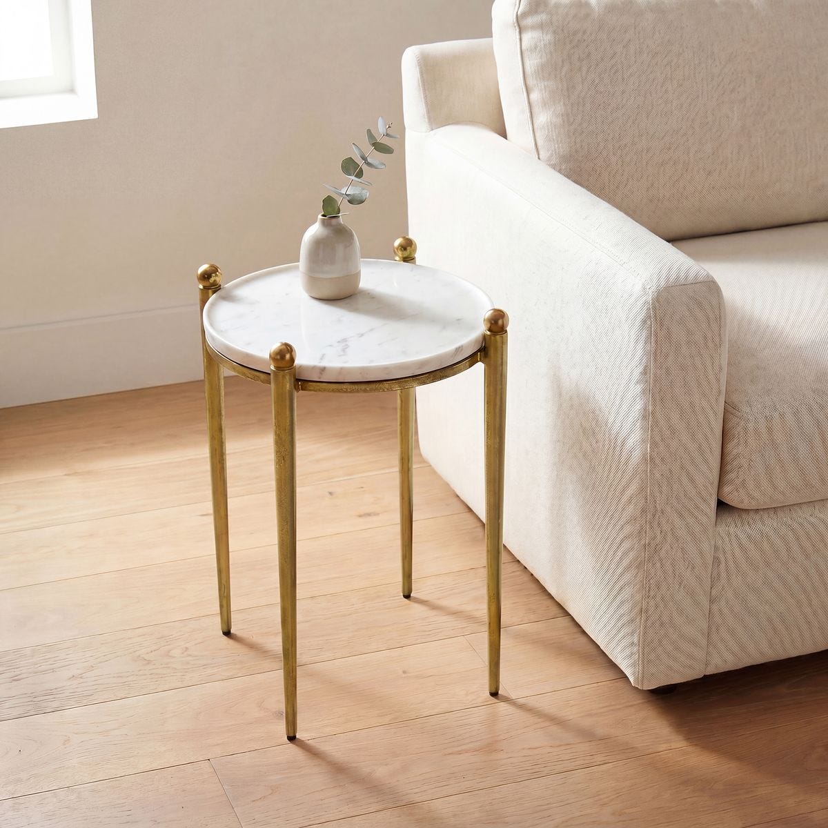 Detail view of the Nahunta Antique Brass Marble Accent Table finish and construction image 5