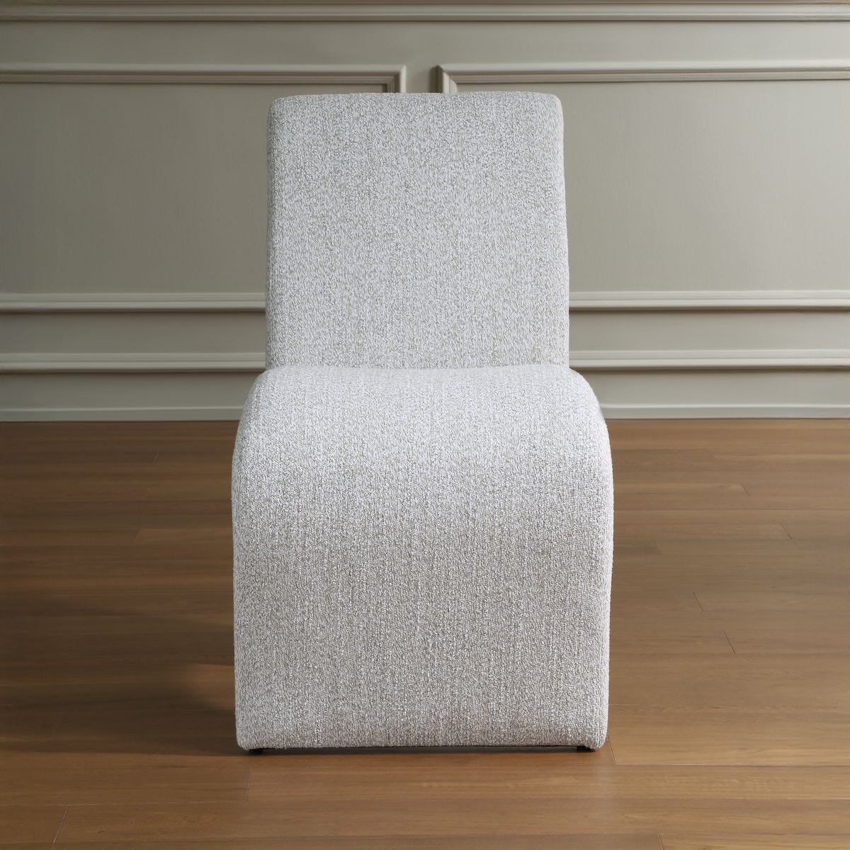 Side view of the Valentin Beige Boucle Sculptural Dining Chair by Uttermost