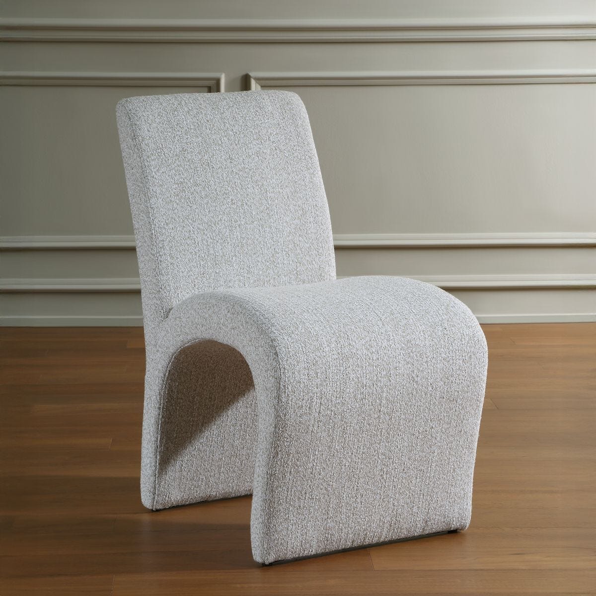 Close-up of the Valentin Beige Boucle Sculptural Dining Chair material and finish