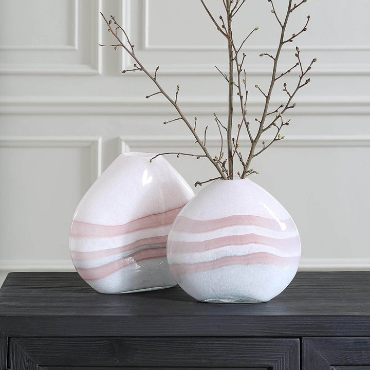 Close-up of pink swirl glass vase showing hand-blown texture and curved silhouette